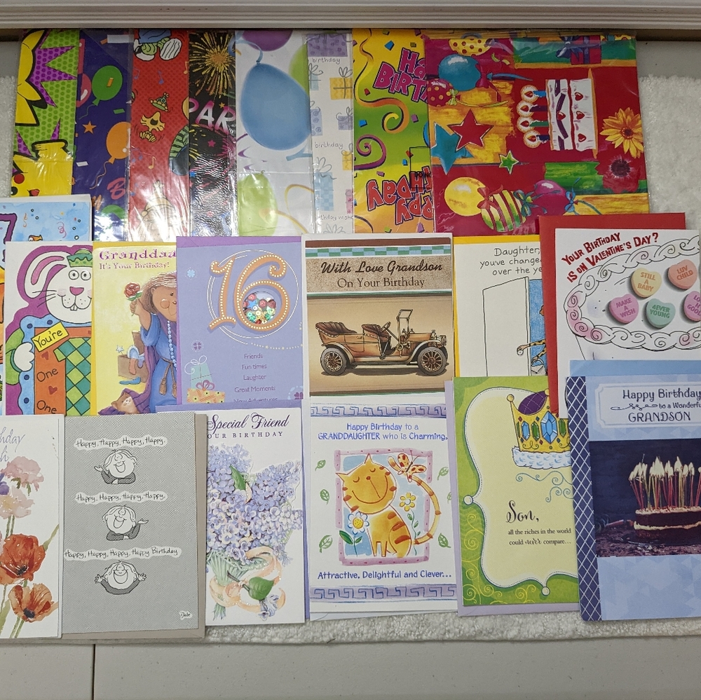 Lot of assorted birthday cards and birthday wrapping paper and candles